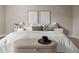 Relaxing bedroom with a soft palette, textured bedding, and sophisticated decor for a serene retreat at 4570 E Yale Ave # 507, Denver, CO 80222