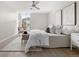 Well-lit bedroom with a ceiling fan, neutral decor, and a comfortable blend of textures for a modern aesthetic at 4570 E Yale Ave # 507, Denver, CO 80222