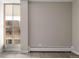 A spacious, empty bedroom featuring a large window, neutral walls, and laminate floors at 4570 E Yale Ave # 507, Denver, CO 80222