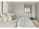Cozy bedroom featuring comfortable bedding, modern furnishings, and a glimpse into the ensuite bathroom at 4570 E Yale Ave # 507, Denver, CO 80222