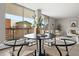 Bright dining area with patio access, showcasing a modern table, chairs, and airy, neutral decor at 4570 E Yale Ave # 507, Denver, CO 80222