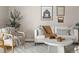 Close up on a living room with modern decor, neutral tones, and a comfortable seating area at 4570 E Yale Ave # 507, Denver, CO 80222