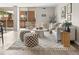 Bright living room with neutral décor, a sliding glass door, and modern furniture at 4570 E Yale Ave # 507, Denver, CO 80222