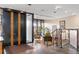 Elegant lobby with a black statement door, seating area, and decorative art at 4570 E Yale Ave # 507, Denver, CO 80222