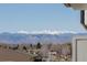Scenic view showcasing snow-capped mountains in the distance over bare trees and building tops at 4570 E Yale Ave # 507, Denver, CO 80222
