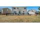 Spacious backyard featuring a large patio with outdoor seating and a grill, perfect for entertaining at 9799 Falcon Ln, Littleton, CO 80125