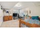 Neutral-toned bedroom with natural light, complete with a dresser, desk, and decorated with achievements and mementos at 9799 Falcon Ln, Littleton, CO 80125