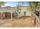 View of backyard with carport and a wooden fence at 1605 Longbow Ct, Lafayette, CO 80026