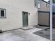 Backyard entrance featuring a covered porch, painted door and concrete steps to the yard at 1605 Longbow Ct, Lafayette, CO 80026