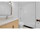 Clean bathroom with white subway tiles in the shower, modern vanity and fixtures at 1605 Longbow Ct, Lafayette, CO 80026