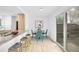 Bright dining area with backyard access, a modern table and chairs, and stylish granite countertops at 1605 Longbow Ct, Lafayette, CO 80026