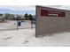 The Great Outdoors Waterpark sign, fenced in with view of waterpark at 1605 Longbow Ct, Lafayette, CO 80026