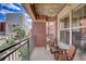 Charming balcony with brick accents, outdoor seating, and city views at 1975 Grant St # 501, Denver, CO 80203