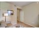 Simple bedroom with neutral walls, carpet, and open closet, offering a calm and inviting space at 1975 Grant St # 501, Denver, CO 80203