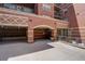 Exterior view of building entrance with covered parking and professional landscaping at 1975 Grant St # 501, Denver, CO 80203