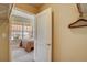 View from closet into bedroom, showcasing natural light and accessible storage at 1975 Grant St # 501, Denver, CO 80203