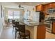 Stylish kitchen with granite counters, stainless steel appliances, and breakfast bar seating at 1975 Grant St # 501, Denver, CO 80203