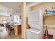 Convenient in-unit laundry closet featuring a stacked washer and dryer unit, maximizing space and efficiency at 1975 Grant St # 501, Denver, CO 80203