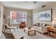 Bright living room with neutral tones, large windows, and stylish furnishings for comfortable living and relaxation at 1975 Grant St # 501, Denver, CO 80203