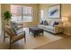 Bright living room featuring a neutral palette, large windows, and contemporary furniture at 1975 Grant St # 501, Denver, CO 80203