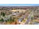 An aerial view shows the neighborhood and school in the distance at 2570 Bell Ct, Lakewood, CO 80215