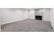 Carpeted basement featuring a tiled fireplace and ample space for entertaining at 2570 Bell Ct, Lakewood, CO 80215