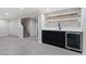 Basement bar area with black cabinetry, a beverage fridge, white countertops and open shelving at 2570 Bell Ct, Lakewood, CO 80215