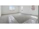 Bright bedroom features neutral carpet, white walls, and large windows for ample natural light at 25224 E Warren Pl, Aurora, CO 80018
