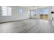 Open living space featuring hard surface flooring, ample natural light, and a neutral color palette to accommodate any style at 25224 E Warren Pl, Aurora, CO 80018