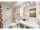 Bathroom with tub, toilet and updated vanity at 9335 E Center Ave # 4B, Denver, CO 80247