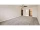 Spacious bedroom with carpet, ceiling fan and access to bathroom at 9335 E Center Ave # 4B, Denver, CO 80247