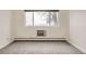 Bright bedroom with large window and wall-to-wall carpet at 9335 E Center Ave # 4B, Denver, CO 80247