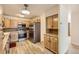 Kitchen with light wood cabinets, stainless steel appliances and tile floor at 9335 E Center Ave # 4B, Denver, CO 80247