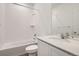 Beautiful bathroom featuring a vanity with quartz countertops, tile shower, and a large mirror at 15276 Fillmore St, Thornton, CO 80602