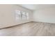 Bright, airy bedroom with modern floors and ample natural light at 15276 Fillmore St, Thornton, CO 80602