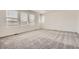 Cozy bedroom with soft carpeting and a large window at 15276 Fillmore St, Thornton, CO 80602