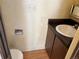 Compact bathroom features a vanity and toilet at 1967 S Oakland Way, Aurora, CO 80014