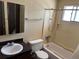 Compact bathroom featuring a standard tub/shower combo, sink, and vanity at 1967 S Oakland Way, Aurora, CO 80014