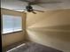 Bedroom featuring neutral walls, ceiling fan, and window at 1967 S Oakland Way, Aurora, CO 80014