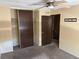 Bedroom featuring closet, ceiling fan, and neutral color walls at 1967 S Oakland Way, Aurora, CO 80014