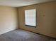Simple bedroom with a window offering natural light, creating a bright and airy space at 1967 S Oakland Way, Aurora, CO 80014