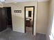 Bedroom featuring door to bathroom, neutral color walls, and carpet at 1967 S Oakland Way, Aurora, CO 80014