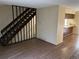 Living room featuring staircase and access to kitchen space at 1967 S Oakland Way, Aurora, CO 80014