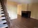 A spacious living room featuring hard wood flooring and a brick fireplace at 1967 S Oakland Way, Aurora, CO 80014