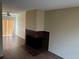 Spacious living room featuring hard wood floors, fan, and a brick fireplace at 1967 S Oakland Way, Aurora, CO 80014