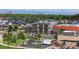 Aerial view showing the townhomes among residences, retail, and views of the Rocky Mountains at 6971 E Lowry Blvd, Denver, CO 80230