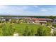 Beautiful community featuring a large green space, walking paths, local dining, and modern townhomes in a vibrant neighborhood at 6971 E Lowry Blvd, Denver, CO 80230