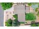 Aerial shot of home showing large backyard, patio, mature landscaping, and roof at 1590 S Macon St, Aurora, CO 80012