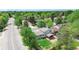 Aerial view of a charming home with a well-maintained backyard and mature trees at 1590 S Macon St, Aurora, CO 80012