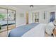 Spacious primary bedroom featuring hardwood floors, a ceiling fan, and a sliding door closet at 1590 S Macon St, Aurora, CO 80012